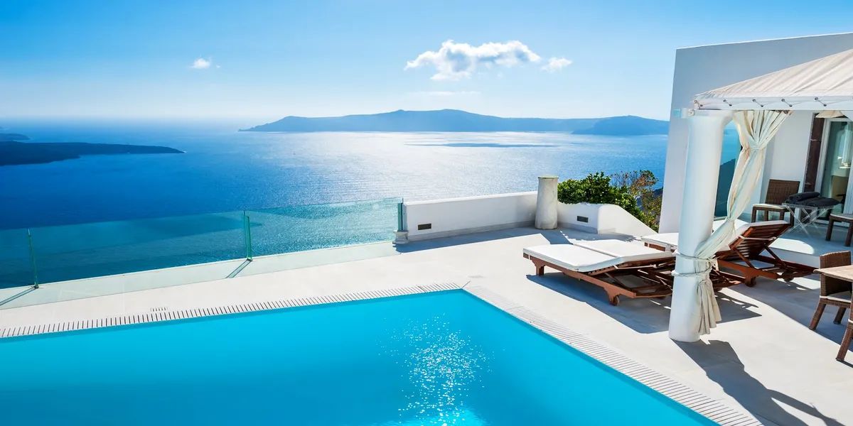 Beautiful poolside vacation scene with palm trees - Allergy-Free Travel